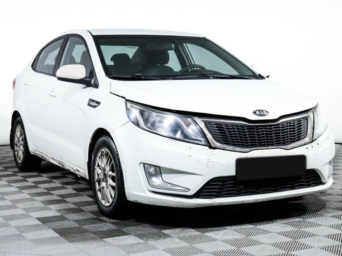 Kia Rio с пробегом — 2013 год. Фото: #2